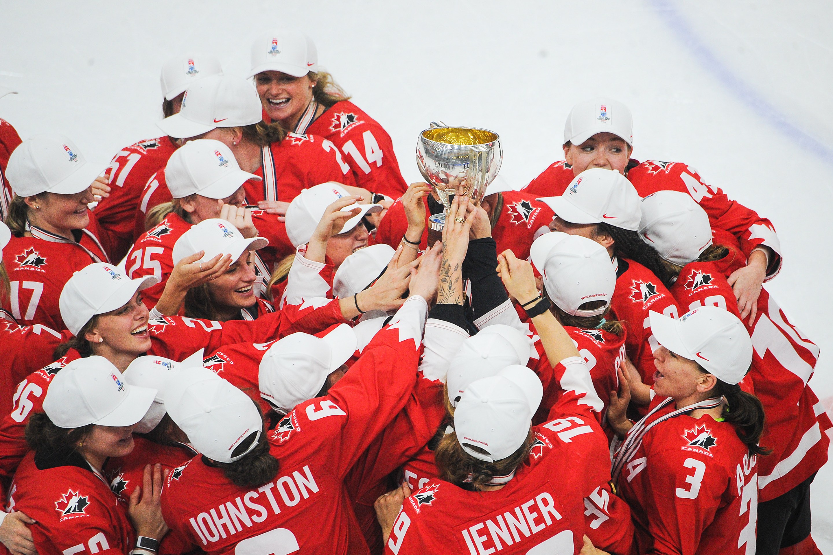 Team Canada hoists the championship trophy after their victory over United Sates in the 2021 IIHF Women's World Championship gold medal game played at WinSport Arena on August 31, 2021 in Calgary, Canada.