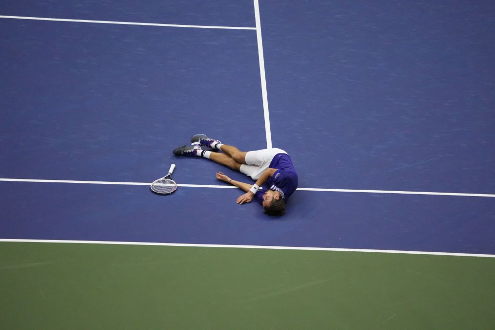 Daniil Medvedev collapses on the court after winning the 2021 U.S. Open.