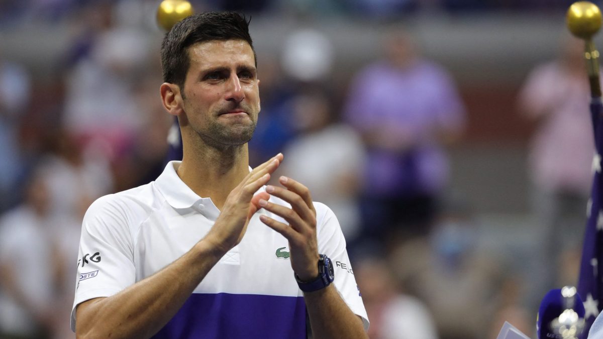 Novak Djokovic applauds the crowd