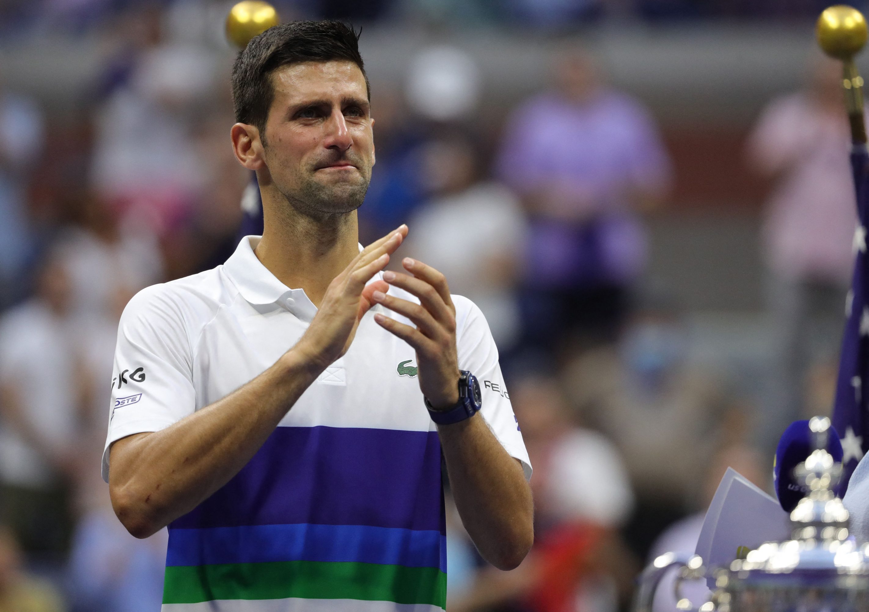 Novak Djokovic applauds the crowd