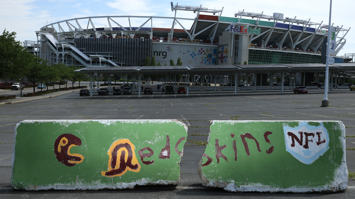 LANDOVER, MARYLAND - JULY 13: Hand painted concrete barriers stand in the parking lot of FedEx Field, home of the NFL's Washington Redskins team July 13, 2020 in Landover, Maryland. The team announced Monday that owner Daniel Snyder and coach Ron Rivera are working on finding a replacement for its racist name and logo after 87 years. (Photo by Chip Somodevilla/Getty Images)