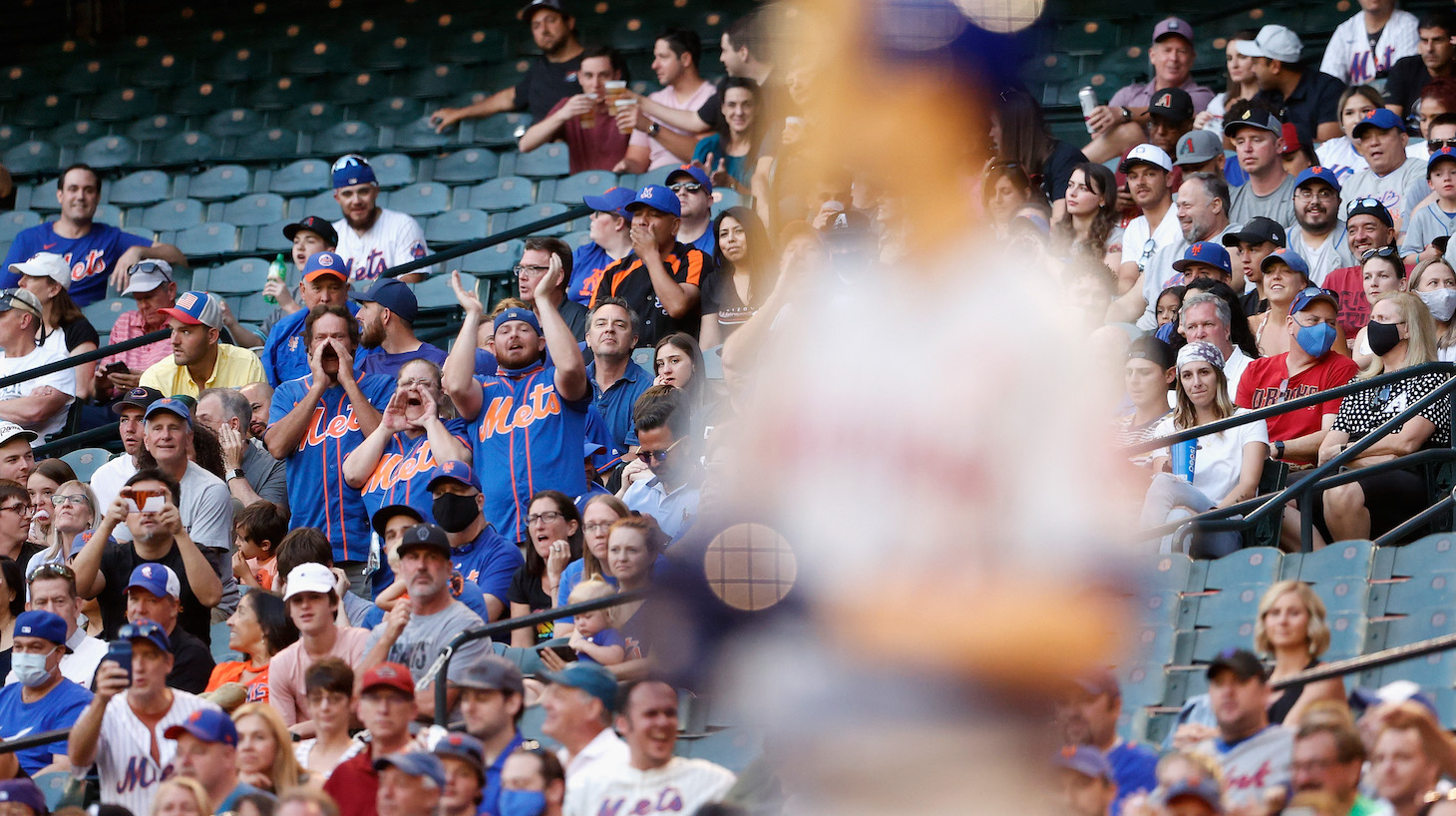 PHOENIX, ARIZONA - MAY 31: Fans of the New York Mets cheer as Jacob deGrom #48 bats against the Arizona Diamondbacks during the third inning of the MLB game at Chase Field on May 31, 2021 in Phoenix, Arizona. (Photo by Christian Petersen/Getty Images)