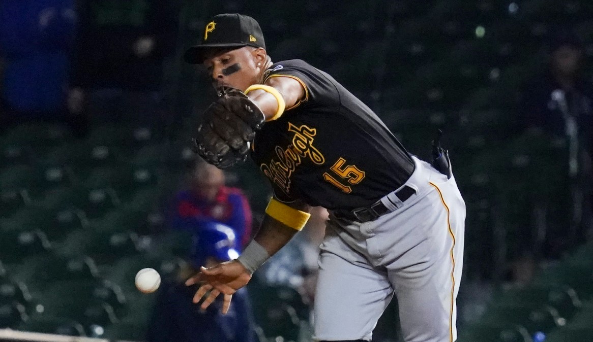 CHICAGO, ILLINOIS - SEPTEMBER 02: Wilmer Difo #15 of the Pittsburgh Pirates commits an error in the 11th inning against the Chicago Cubs at Wrigley Field on September 02, 2021 in Chicago, Illinois. The Cubs won 6-5 in 11 innings. (Photo by Nuccio DiNuzzo/Getty Images)