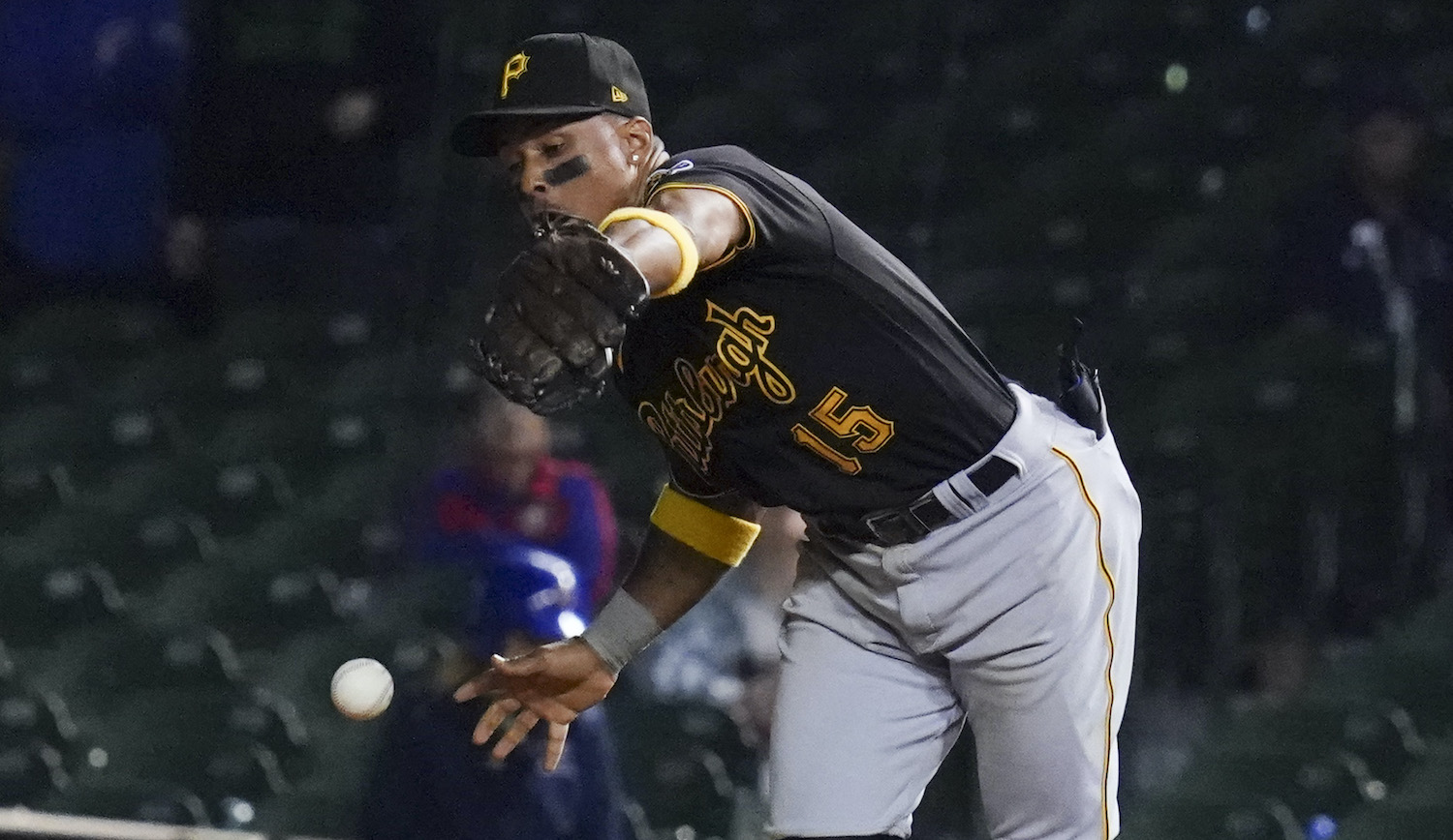 CHICAGO, ILLINOIS - SEPTEMBER 02: Wilmer Difo #15 of the Pittsburgh Pirates commits an error in the 11th inning against the Chicago Cubs at Wrigley Field on September 02, 2021 in Chicago, Illinois. The Cubs won 6-5 in 11 innings. (Photo by Nuccio DiNuzzo/Getty Images)