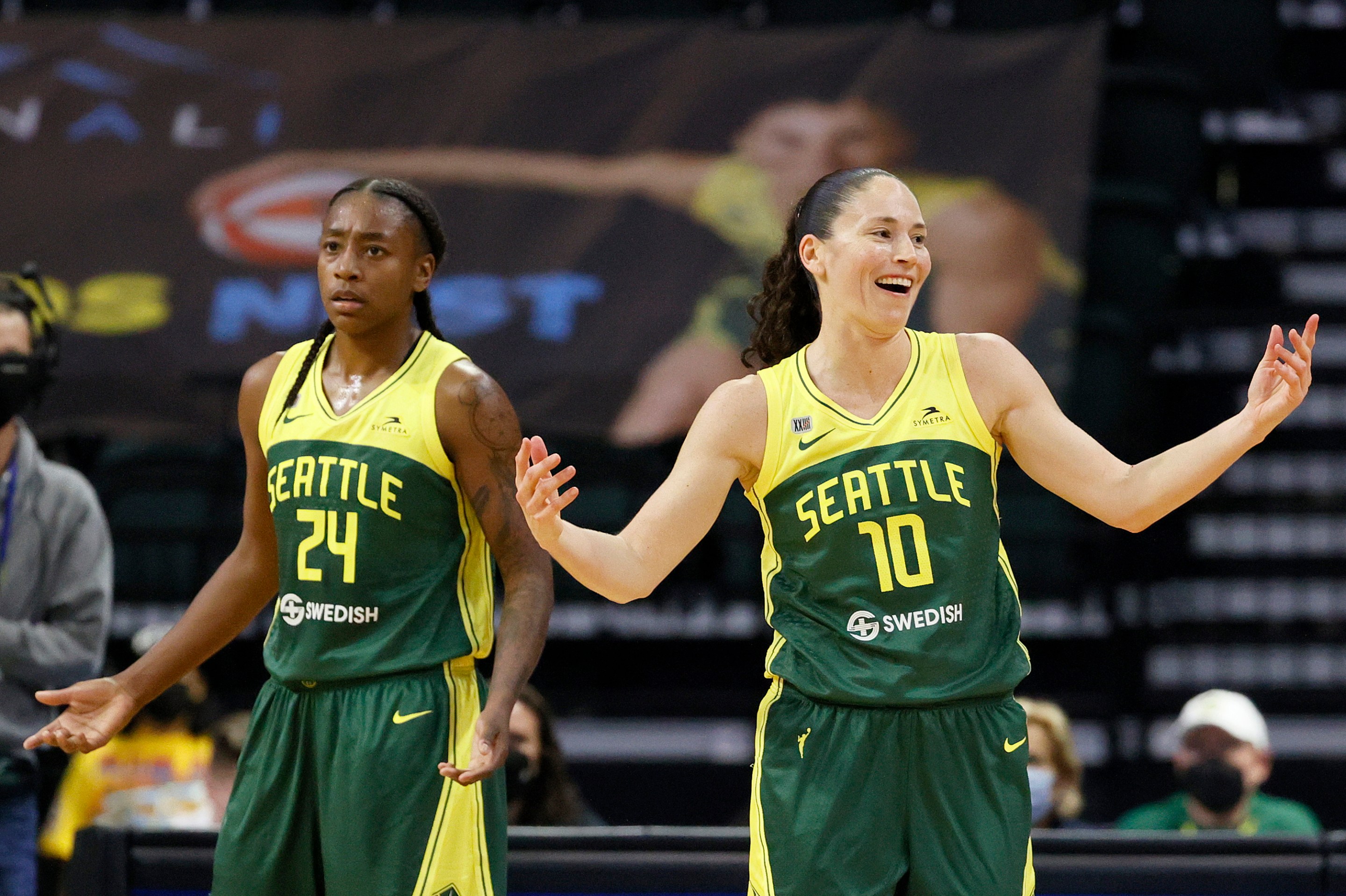Jewell Loyd #24 and Sue Bird #10 of the Seattle Storm react during the second quarter against the Washington Mystics at Angel of the Winds Arena on September 07, 2021 in Everett, Washington.
