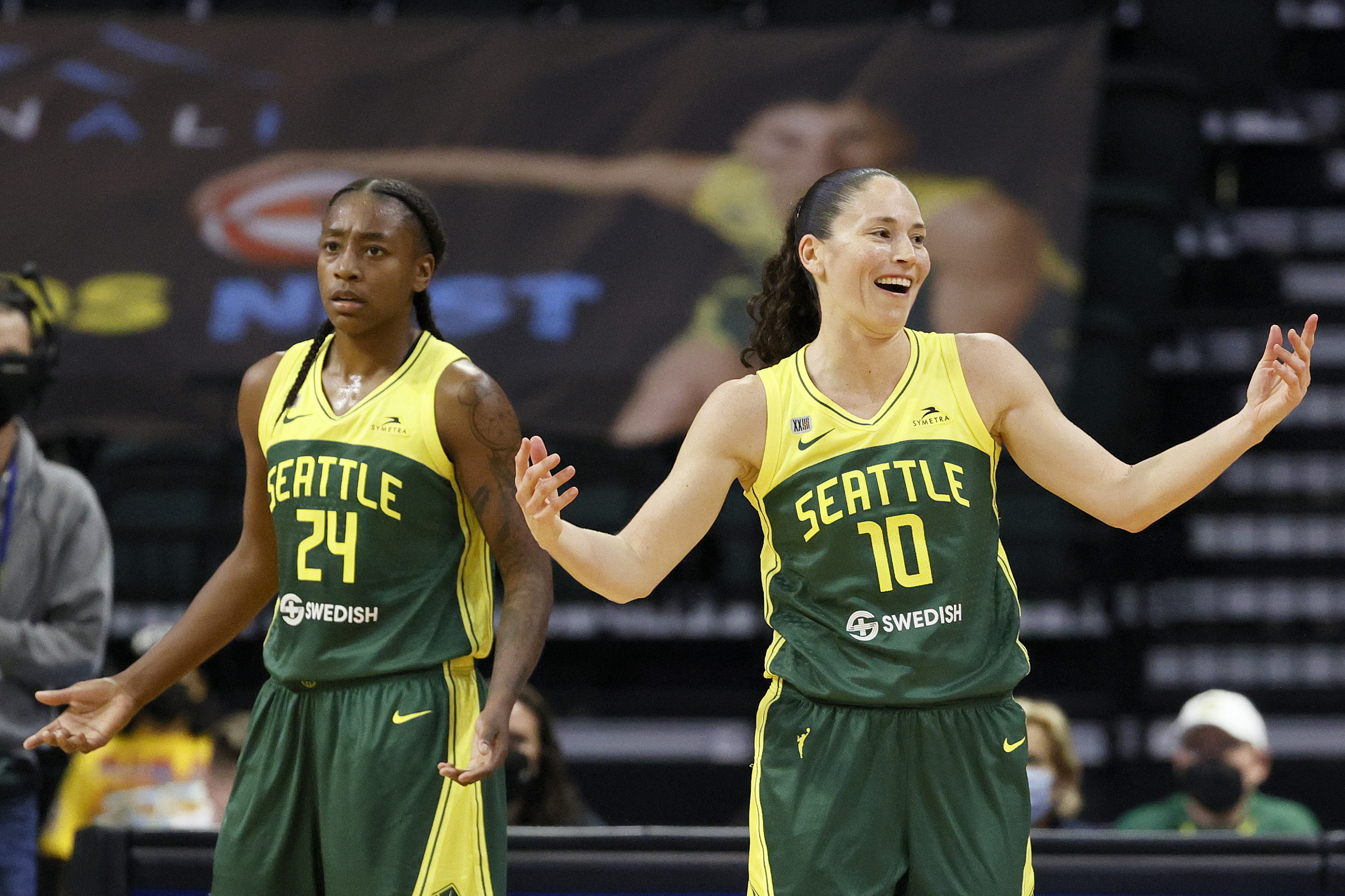 Jewell Loyd #24 and Sue Bird #10 of the Seattle Storm react during the second quarter against the Washington Mystics at Angel of the Winds Arena on September 07, 2021 in Everett, Washington.