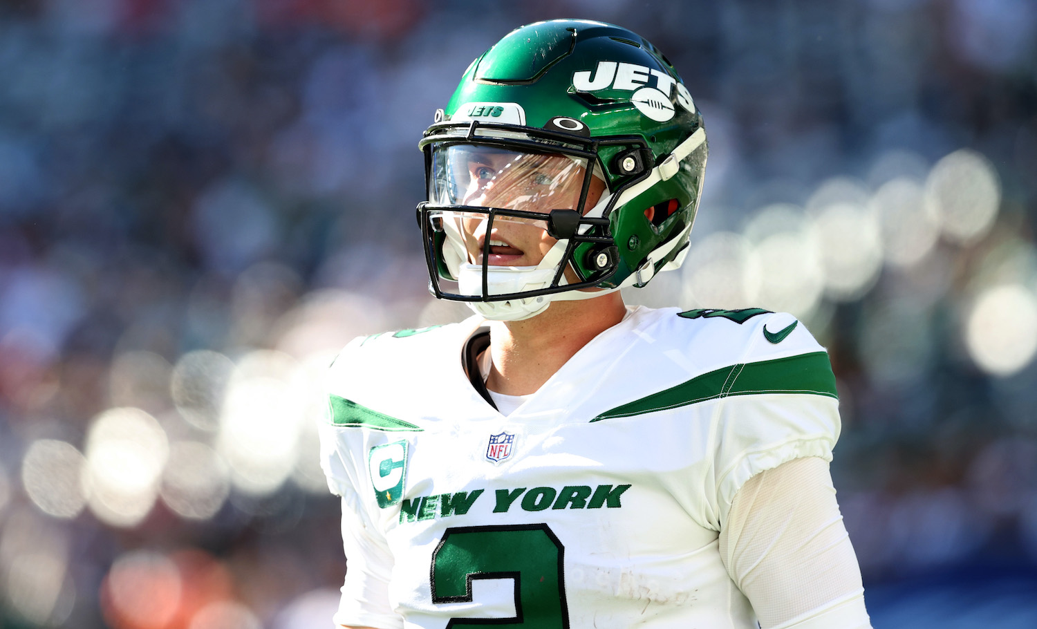 EAST RUTHERFORD, NEW JERSEY - SEPTEMBER 19: Quarterback Zach Wilson #2 of the New York Jets looks on during the fourth quarter against the New England Patriots at MetLife Stadium on September 19, 2021 in East Rutherford, New Jersey. (Photo by Elsa/Getty Images)