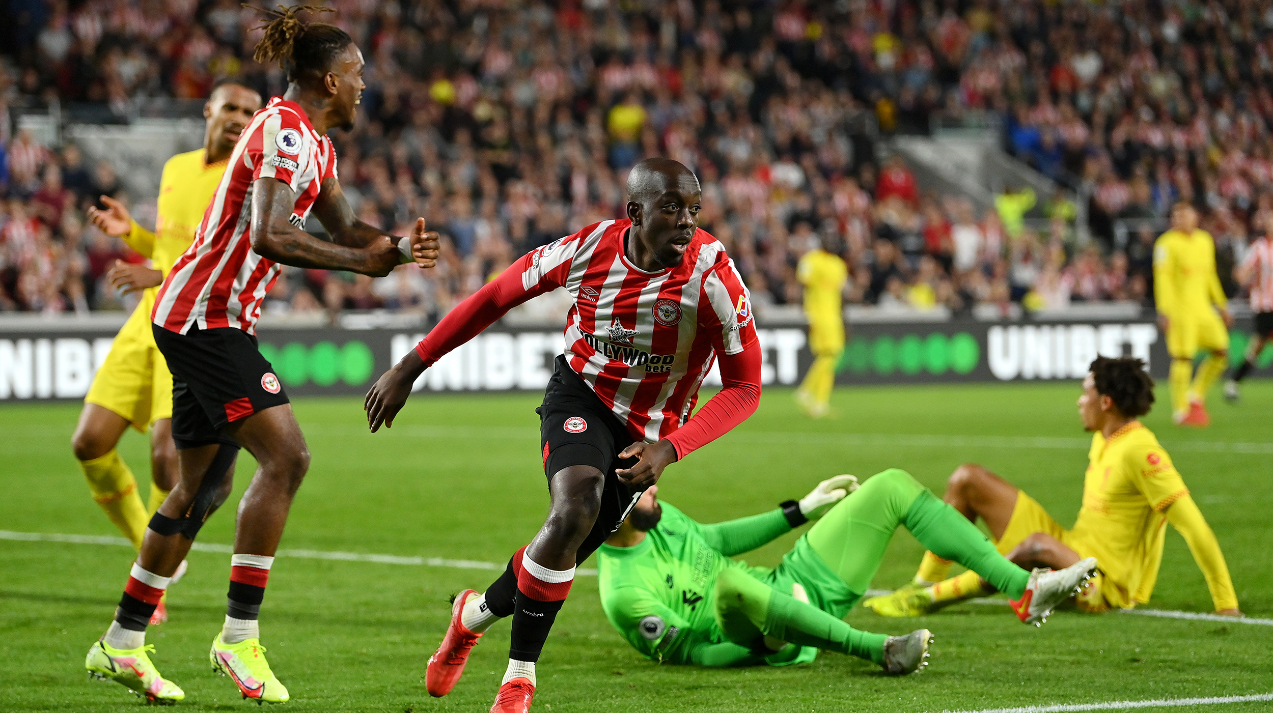Yoane Wissa of Brentford celebrates scoring his sides third goal during the Premier League match between Brentford and Liverpool at Brentford Community Stadium on September 25, 2021 in Brentford, England.