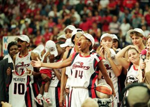 Cynthia Cooper #14 of the Houston Comets yells in celebration on the court after winning game three of the WNBA Finals against the New York Liberty at the Compaq Center in Houston, Texas.
