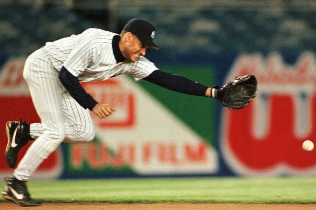 Derek Jeter, New York Yankees, stretches toward a ground ball