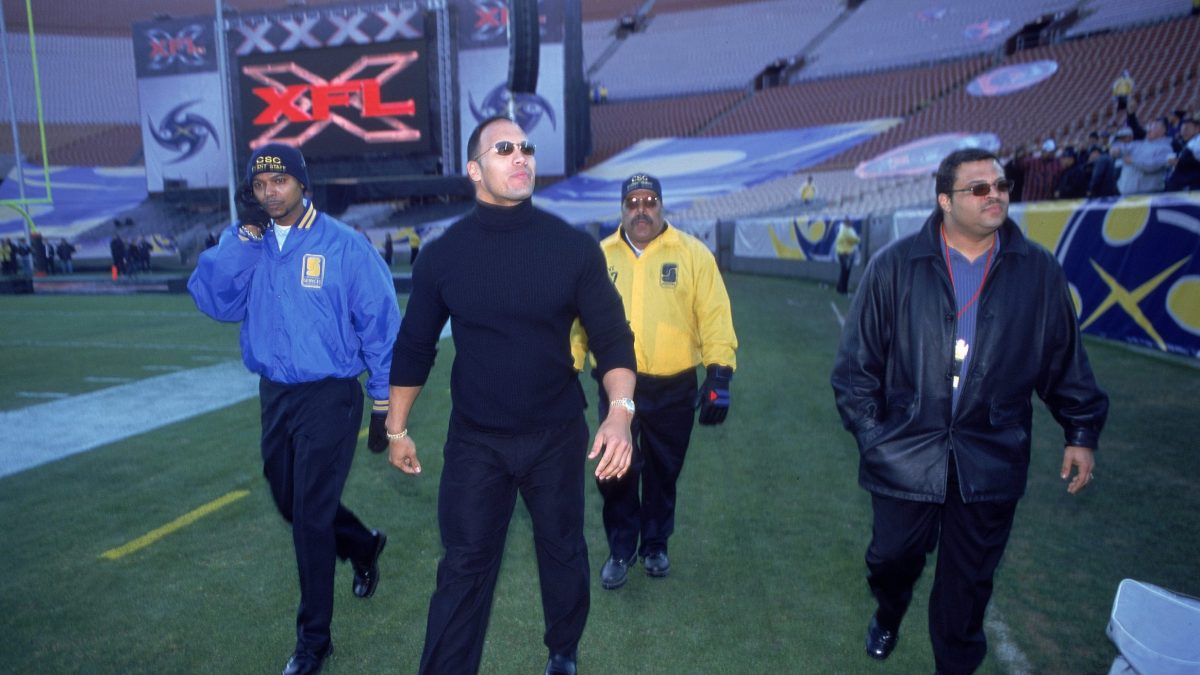 The Rock greets fans before an XFL game
