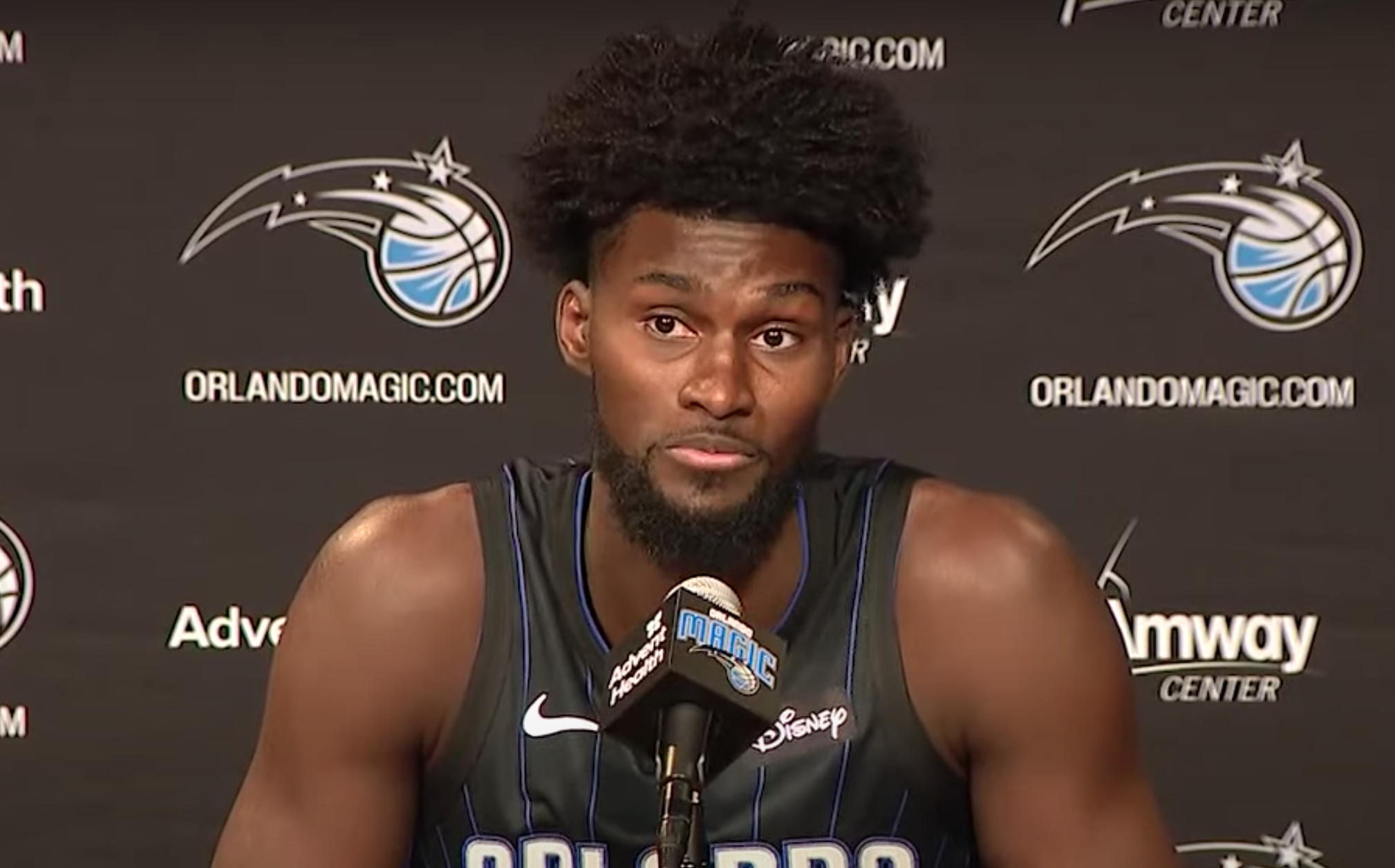Jonathan Isaac answers questions at the podium on media day.