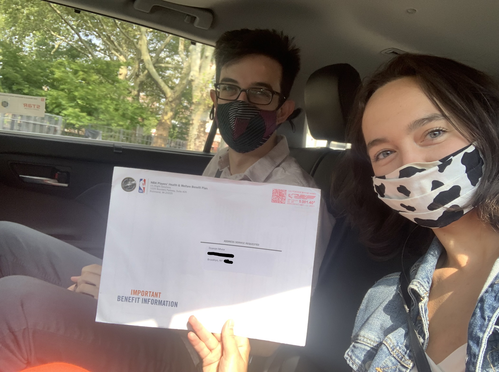 Laura Wagner and Samer Kalaf in a car with the important mail.