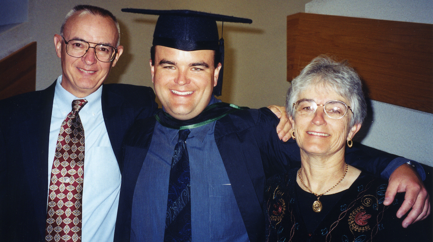 Photo of Andrew Bagby and his parents David and Kathleen Bagby at Andrew's graduation from medical school.