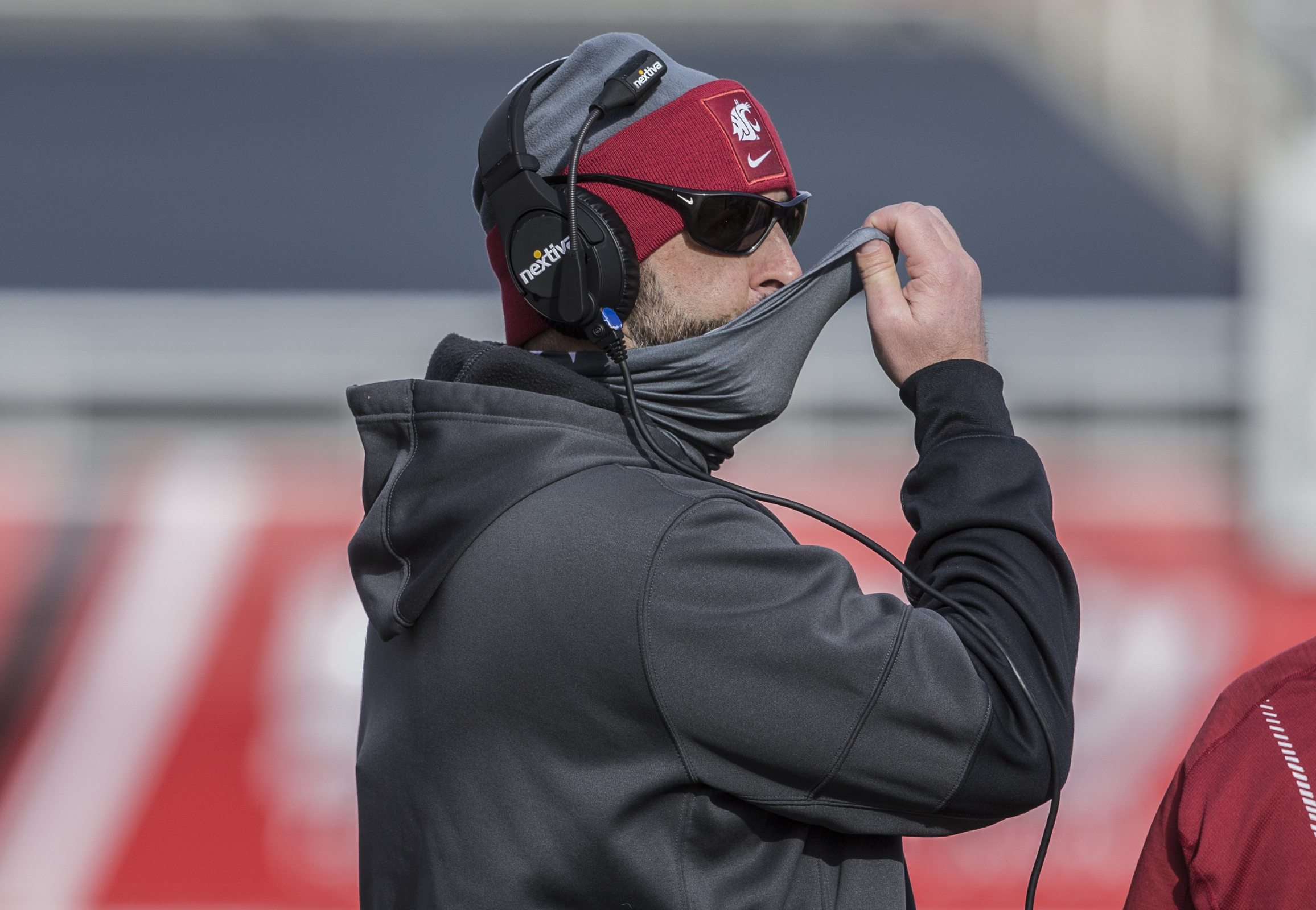 Washington State coach Nick Rolovich, simultaneously wearing and not wearing a mask in a 2020 loss to Utah.