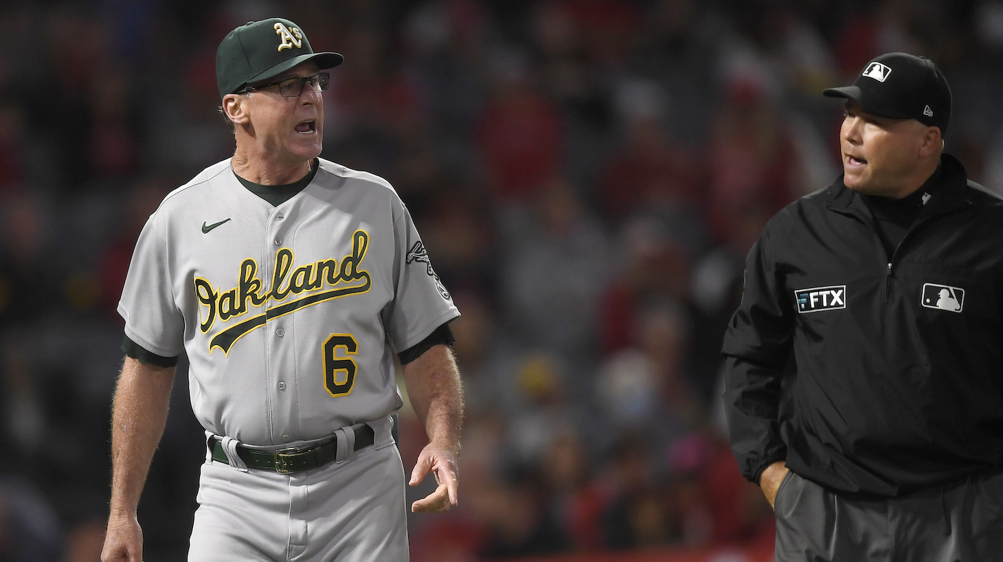 ANAHEIM, CA - SEPTEMBER 18: Manager Bob Melvin #6 of the Oakland Athletics argues with umpire Mark Carlson #6 after a call was reversed during the seventh inning against Los Angeles Angels at Angel Stadium of Anaheim on September 18, 2021 in Anaheim, California. (Photo by Kevork Djansezian/Getty Images)