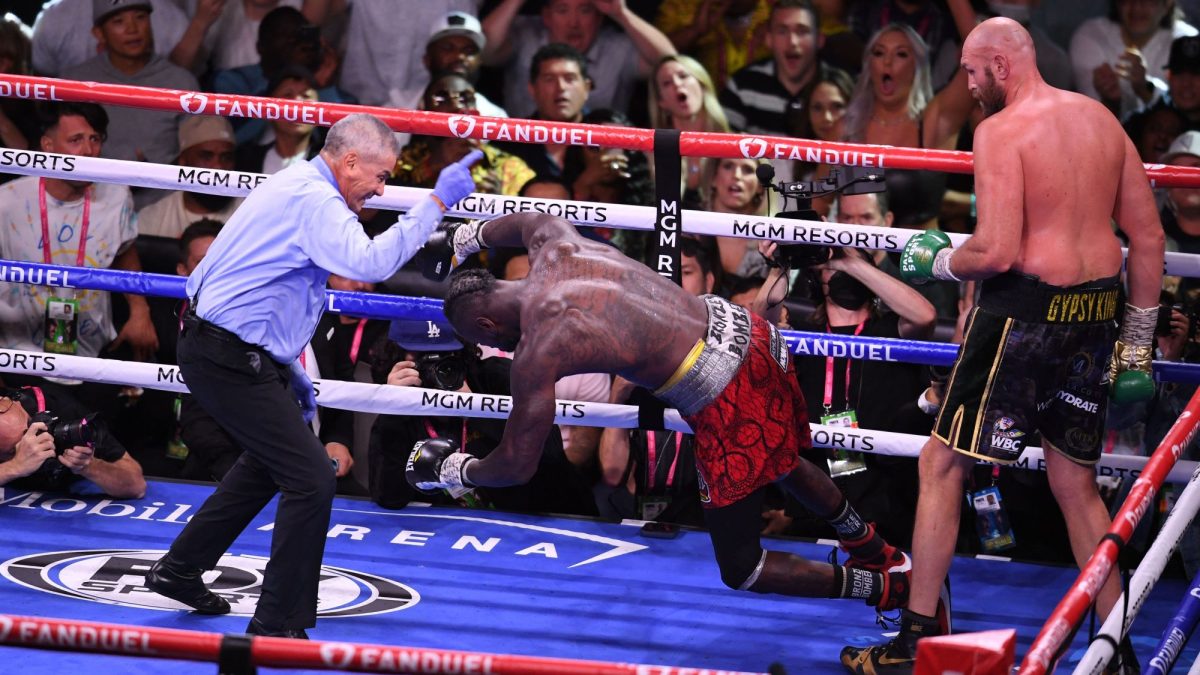 Deontay Wilder falls to the mat