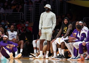 LeBron James dressed like a dang fisherman on the sideline during a Lakers preseason game