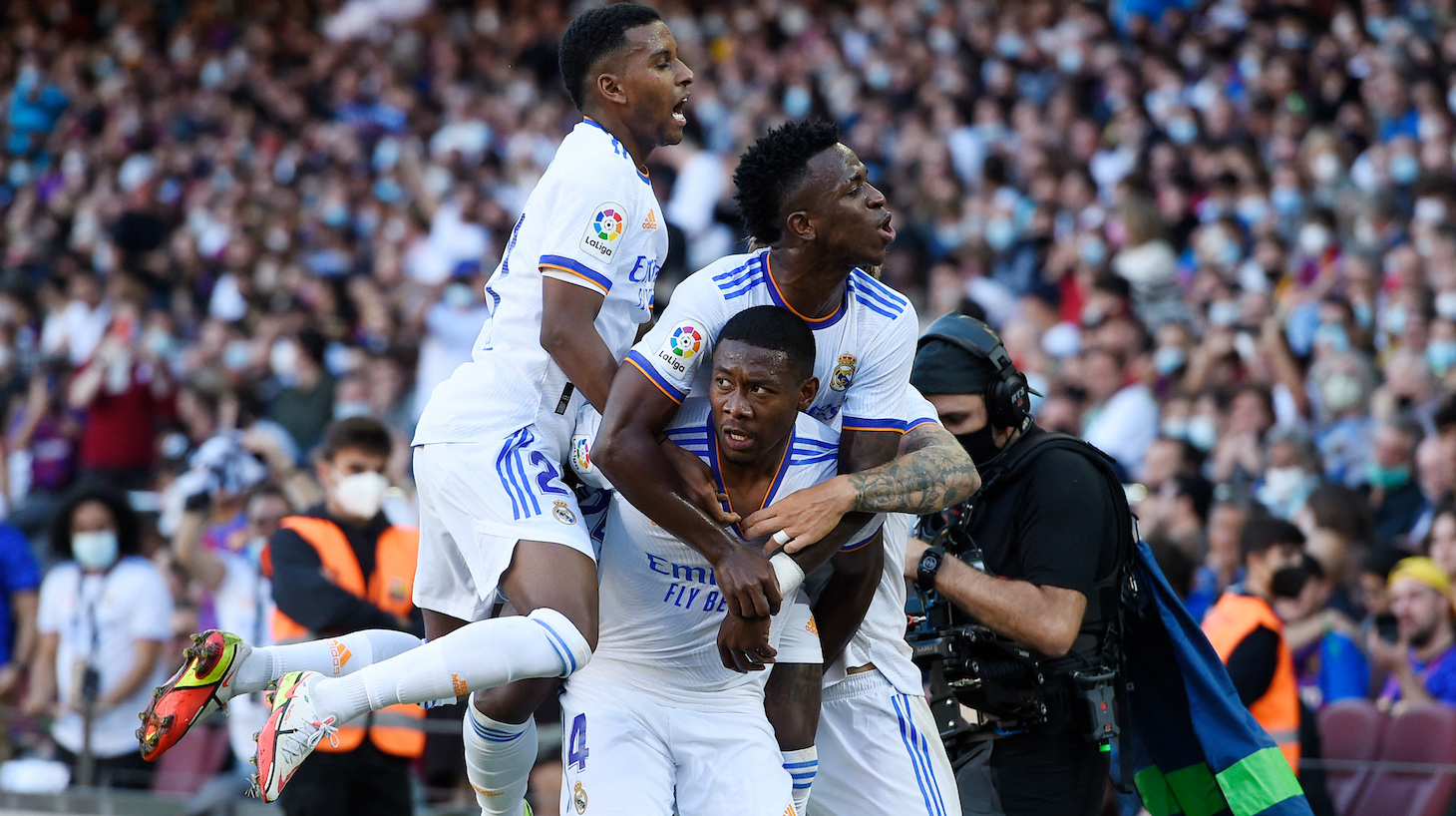 Real Madrid's Austrian defender David Alaba celebrates scoring the opening goal during the Spanish League football match between FC Barcelona and Real Madrid CF at the Camp Nou stadium in Barcelona on October 24, 2021.