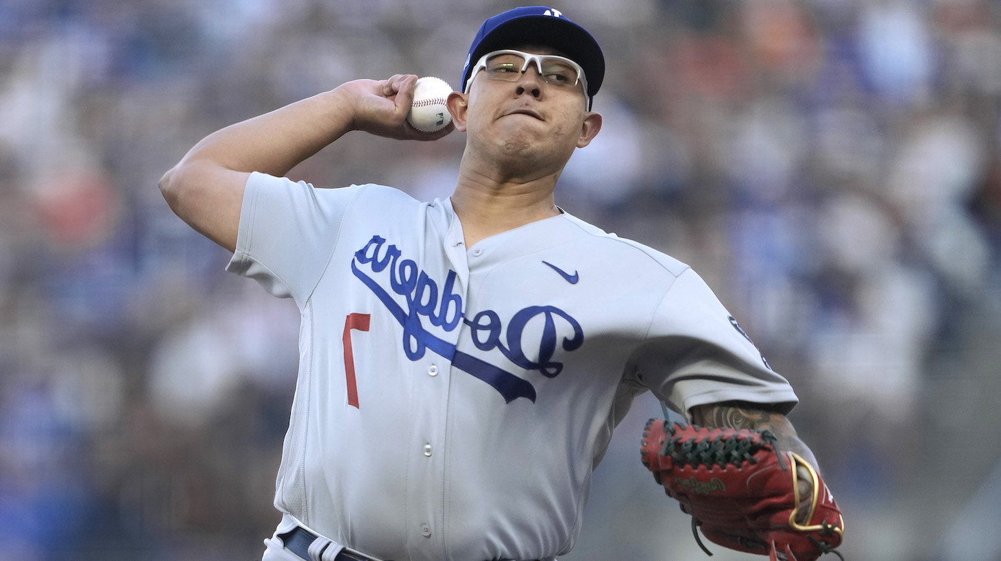 Starting pitcher Julio Urias #7 of the Los Angeles Dodgers warms