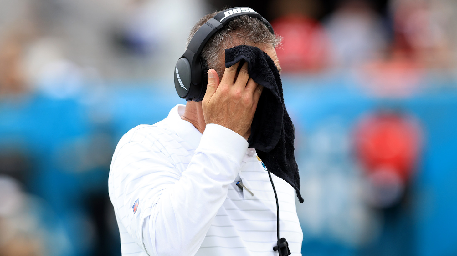 JACKSONVILLE, FLORIDA - SEPTEMBER 19: Head coach Urban Meyer of the Jacksonville Jaguars wipes his face with a towel during the game against the Denver Broncos at TIAA Bank Field on September 19, 2021 in Jacksonville, Florida. (Photo by Sam Greenwood/Getty Images)