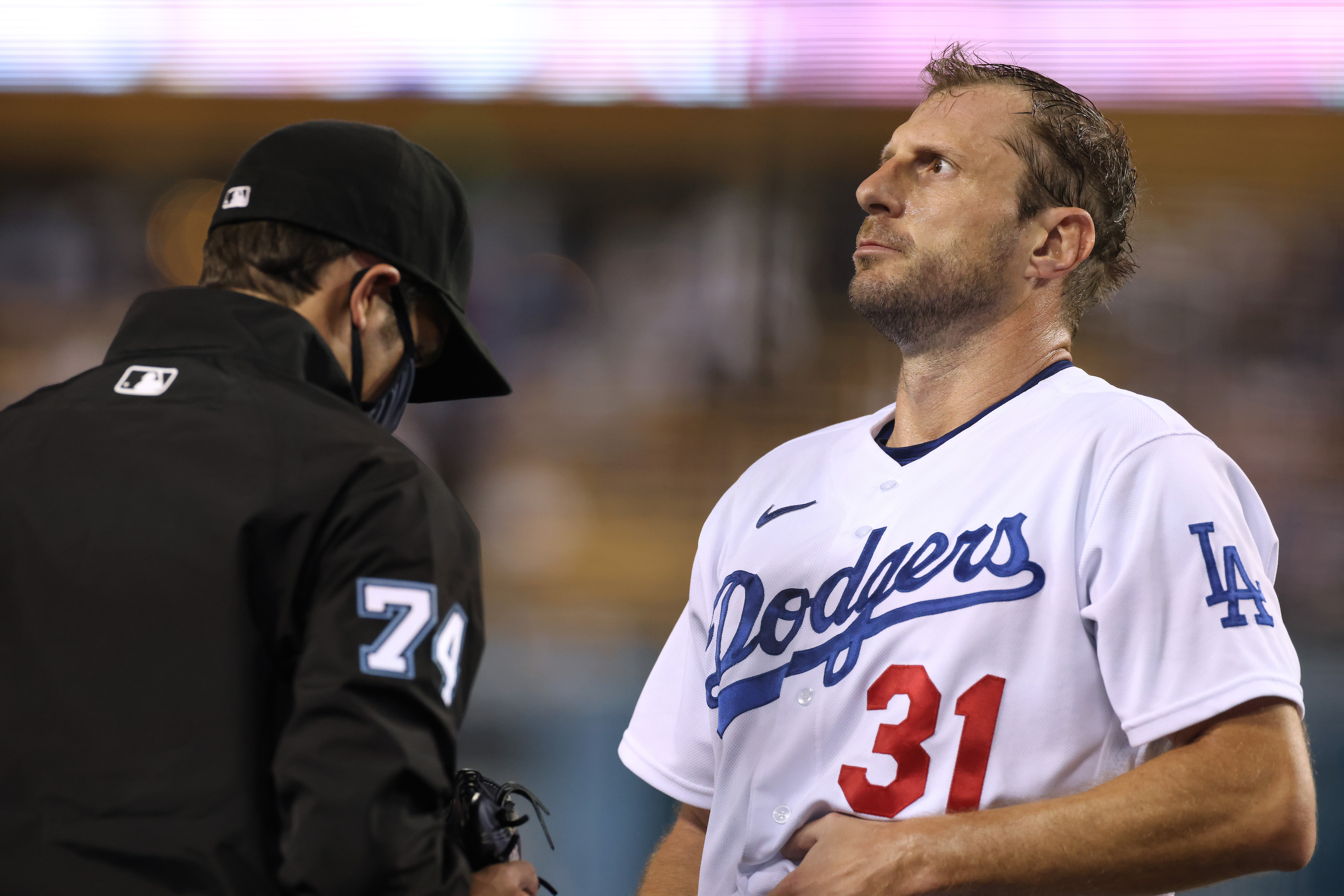 Max Scherzer is very patiently inspected for sticky stuff contamination during a September Dodgers game.