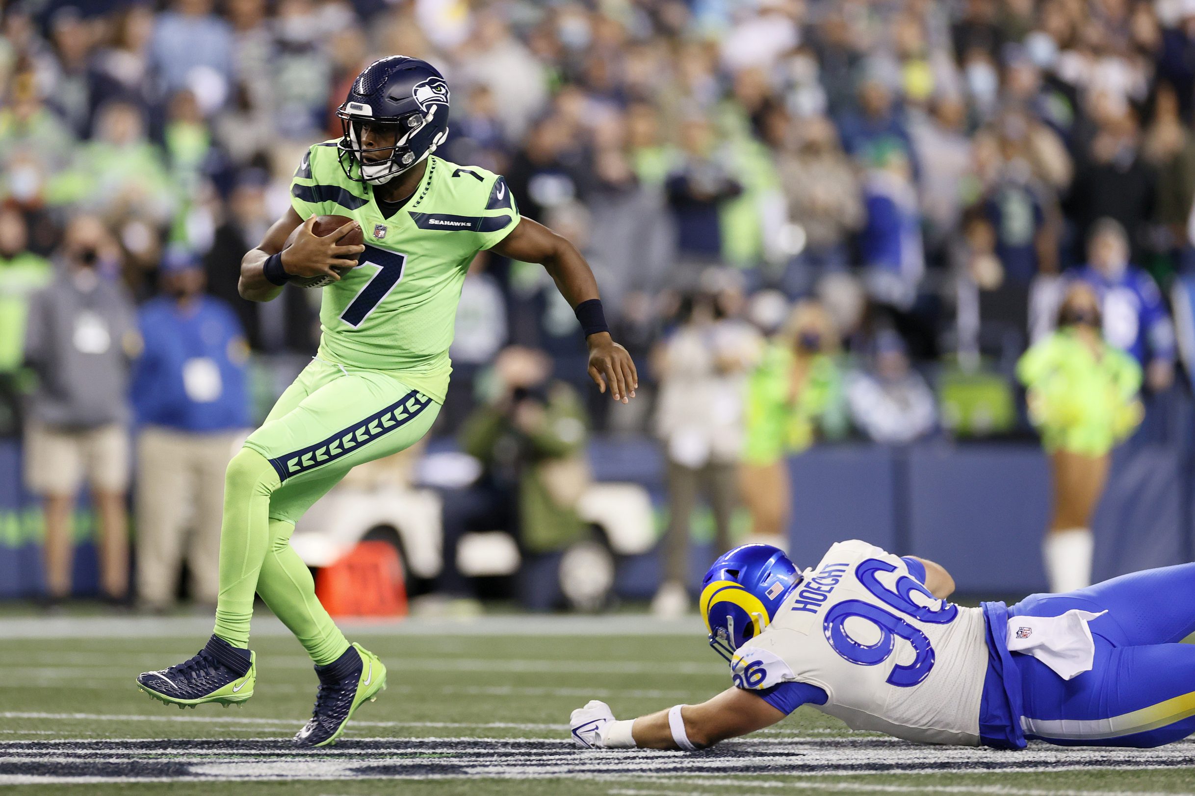 Geno Smith carries the ball