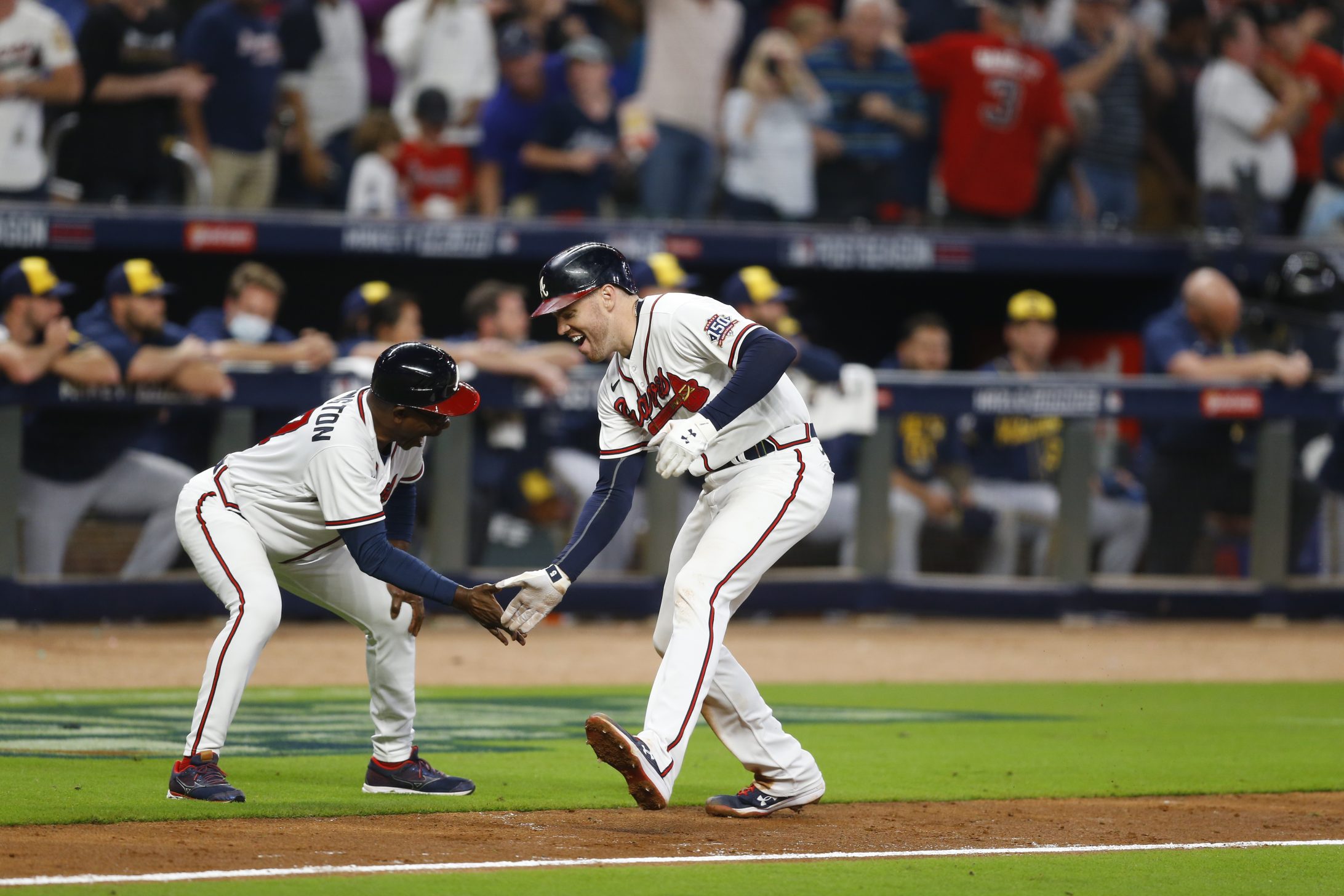 Freddie Freeman high fives Ron Washington
