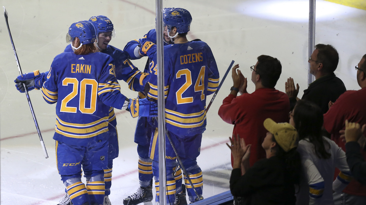 BUFFALO, NEW YORK - OCTOBER 16: Buffalo Sabres players celebrate a goal by Cody Eakin #20 during the second period of a NHL hockey game against the Arizona Coyotes at KeyBank Center on October 16, 2021 in Buffalo, New York. (Photo by Joshua Bessex/Getty Images)