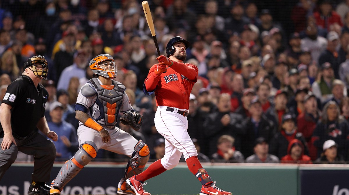 Kyle Schwarber #18 of the Boston Red Sox hits a grand slam home run against the Houston Astros in the second inning of Game Three of the American League Championship Series at Fenway Park on October 18, 2021 in Boston, Massachusetts.