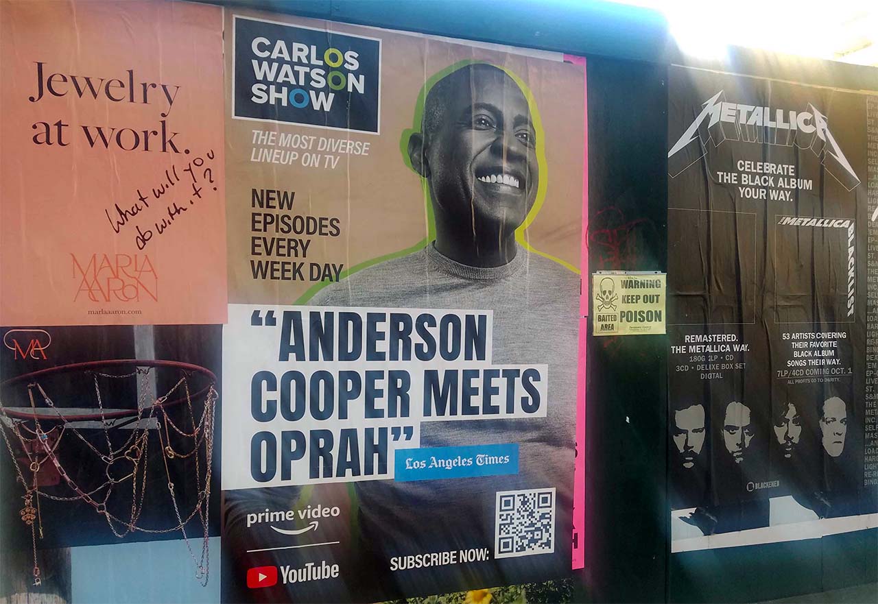 An ad for the Carlos Watson show. A quote calls him "Anderson Cooper Meets Oprah" on it.