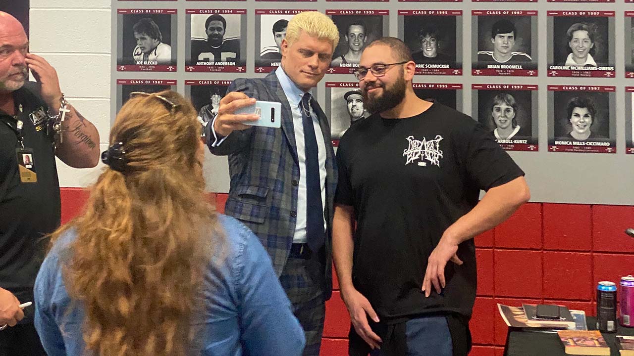 Cody Rhodes taking a selfie with a fan