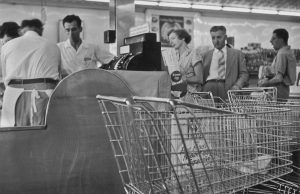 Waiting in line at the checkout in a supermarket circa 1960