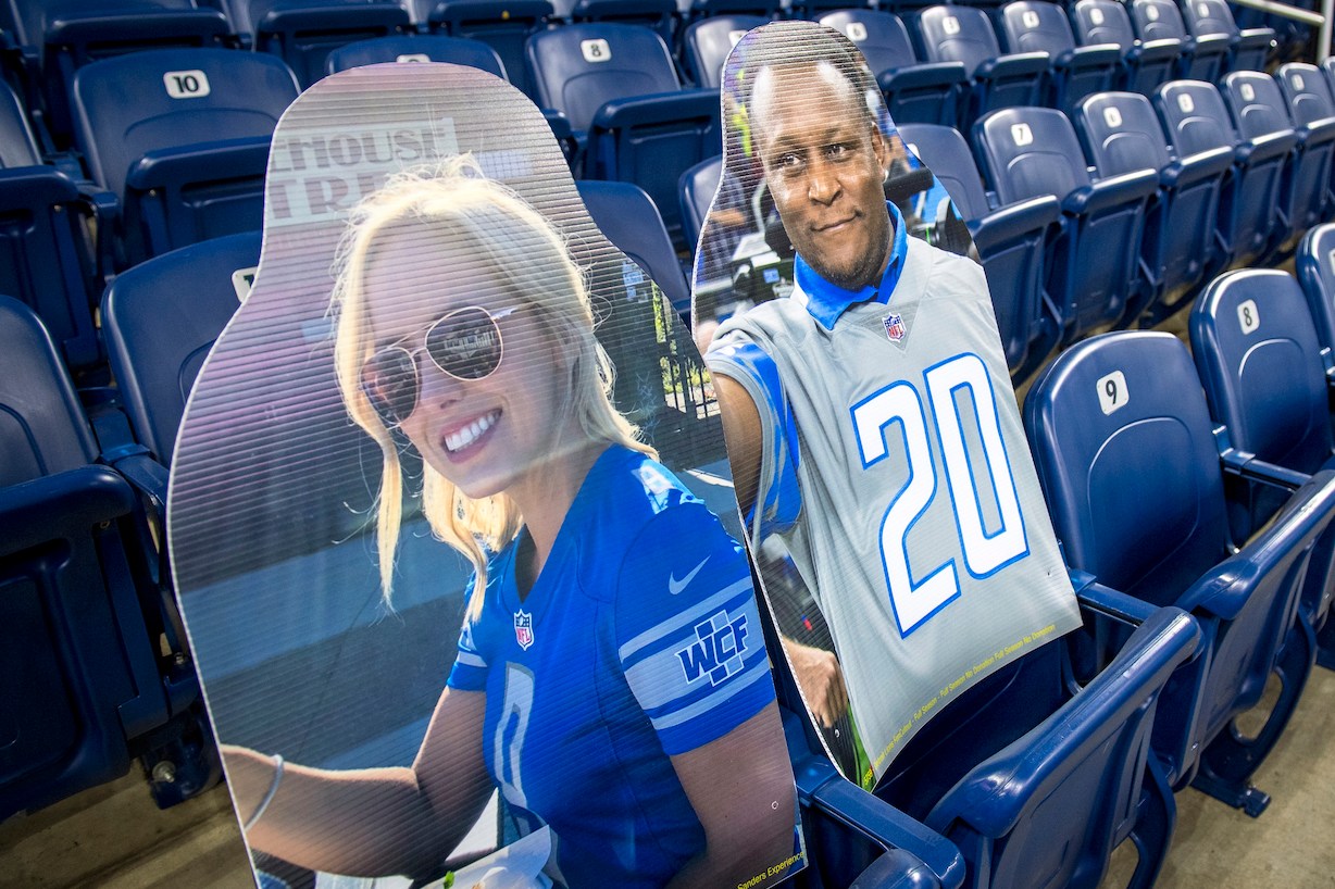 DETROIT, MI - SEPTEMBER 13: Kelly Stafford, wife of Matthew Stafford #9 of the Detroit Lions, appears next to Hall of Fame running back Barry Sanders in cutouts in the stands for the game against the Chicago Bears at Ford Field on September 13, 2020 in Detroit, Michigan. (Photo by Nic Antaya/Getty Images)