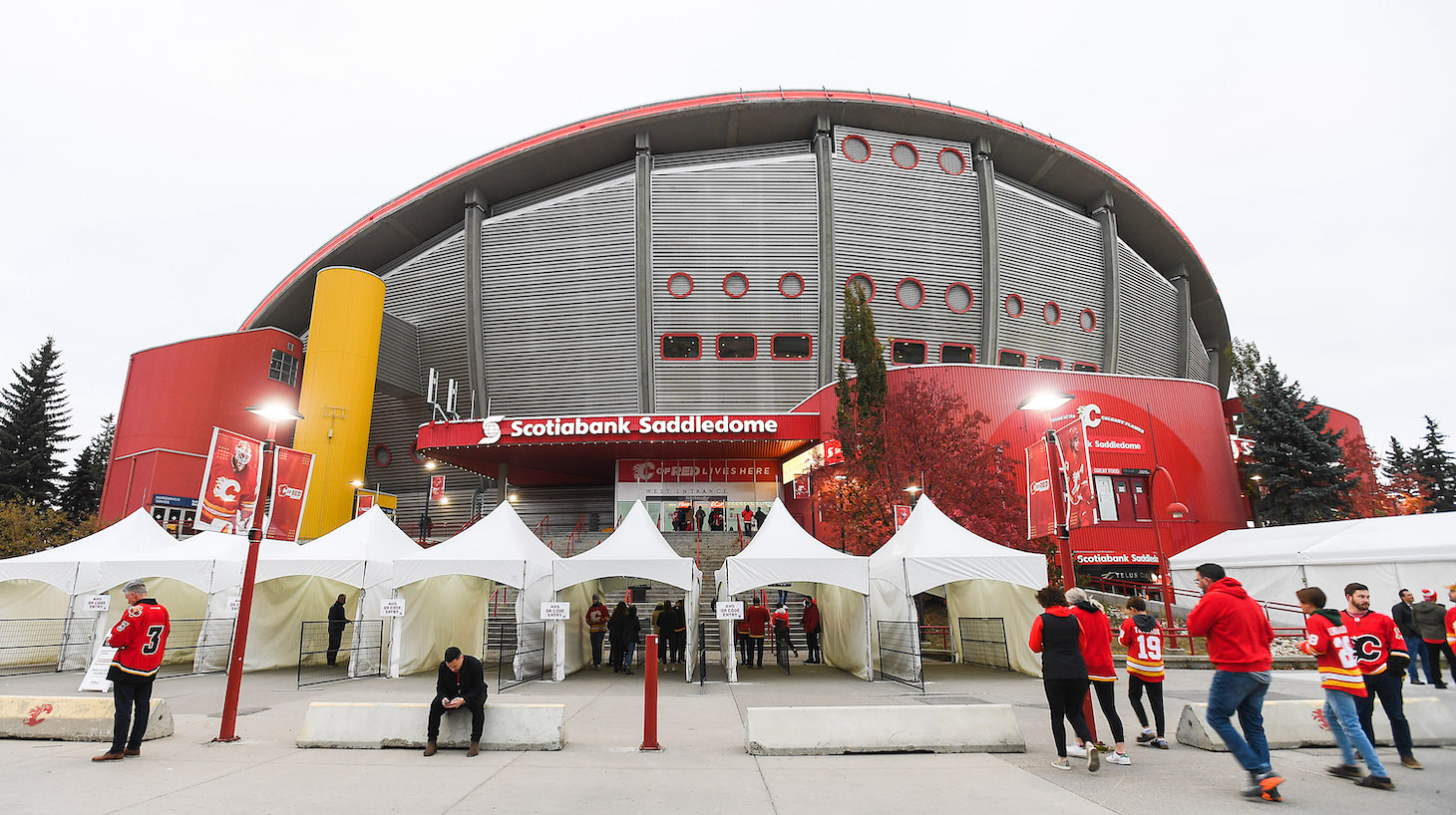 CALGARY, AB - OCTOBER 18: A general view of the exterior of Scotiabank Saddledome as fans arrive and are checked for their Covid vaccinations prior to an NHL game between the Calgary Flames and the Anaheim Ducks on October 18, 2021 in Calgary, Alberta, Canada. (Photo by Derek Leung/Getty Images)
