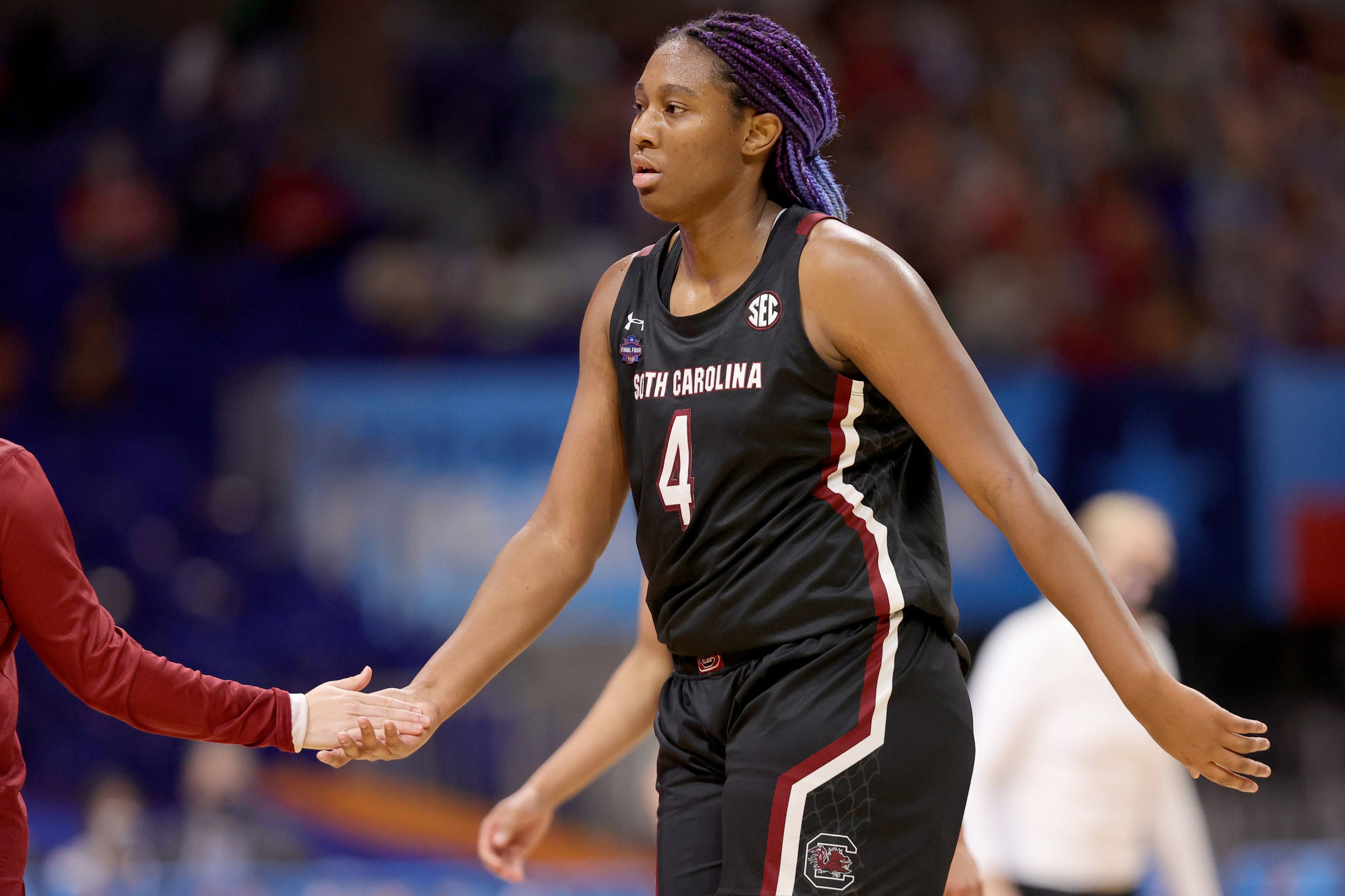 SAN ANTONIO, TEXAS - APRIL 02: Aliyah Boston #4 of the South Carolina Gamecocks celebrates with teammates against the Stanford Cardinal during the second quarter in the Final Four semifinal game of the 2021 NCAA Women's Basketball Tournament at the Alamodome on April 02, 2021 in San Antonio, Texas.
