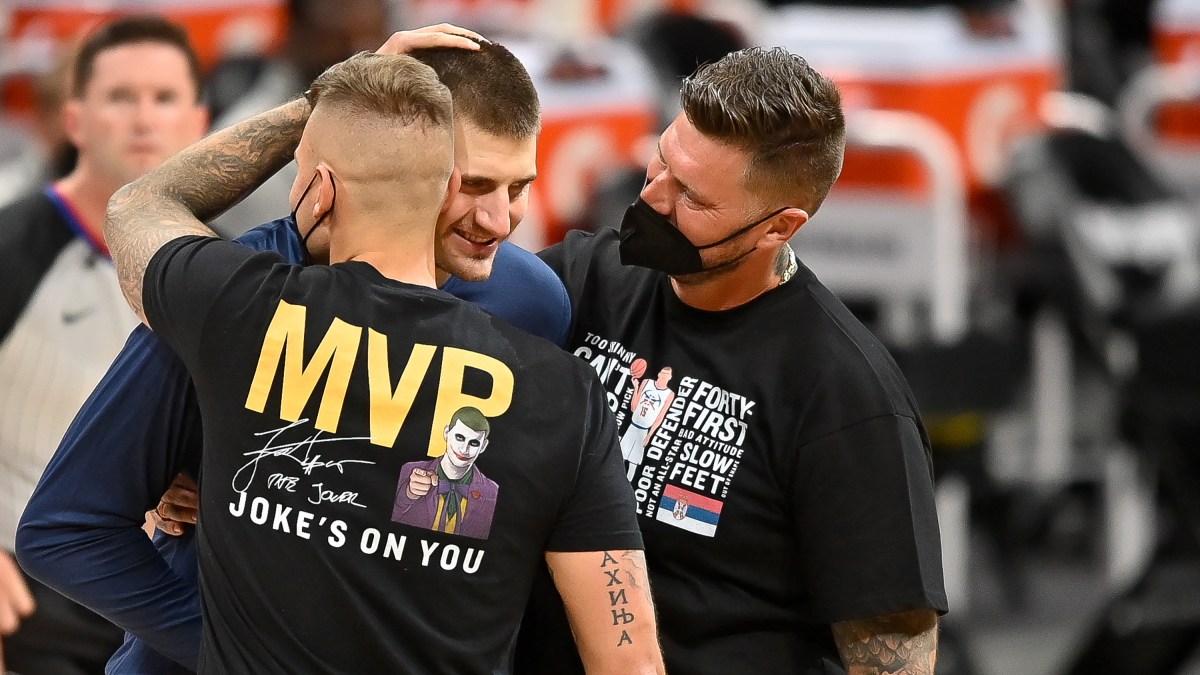 The older brothers of Nikola Jokic celebrate his winning the MVP trophy.