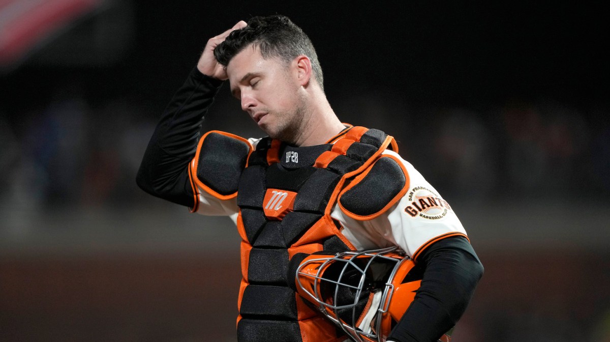 SAN FRANCISCO, CALIFORNIA - OCTOBER 14: Buster Posey #28 of the San Francisco Giants reacts after a single by Gavin Lux #9 of the Los Angeles Dodgers during the ninth inning in game 5 of the National League Division Series at Oracle Park on October 14, 2021 in San Francisco, California. (Photo by Thearon W. Henderson/Getty Images)
