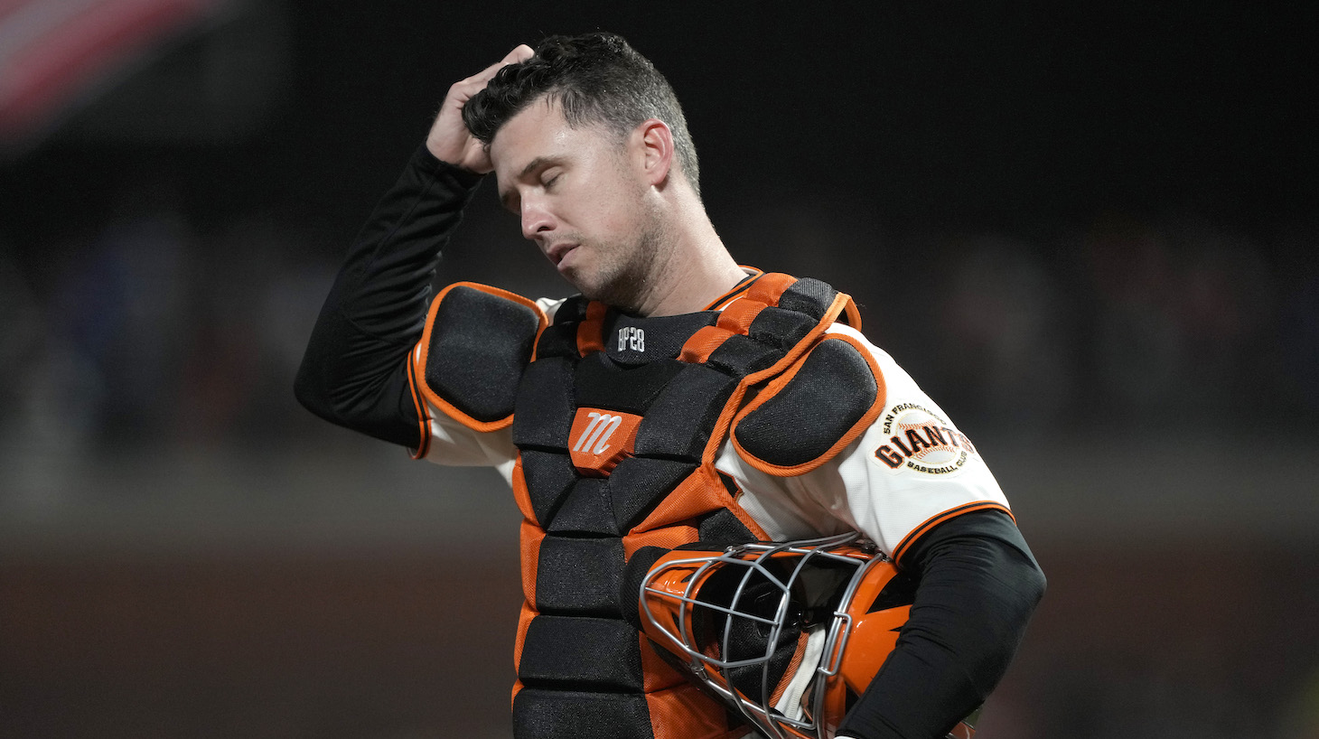 SAN FRANCISCO, CALIFORNIA - OCTOBER 14: Buster Posey #28 of the San Francisco Giants reacts after a single by Gavin Lux #9 of the Los Angeles Dodgers during the ninth inning in game 5 of the National League Division Series at Oracle Park on October 14, 2021 in San Francisco, California. (Photo by Thearon W. Henderson/Getty Images)