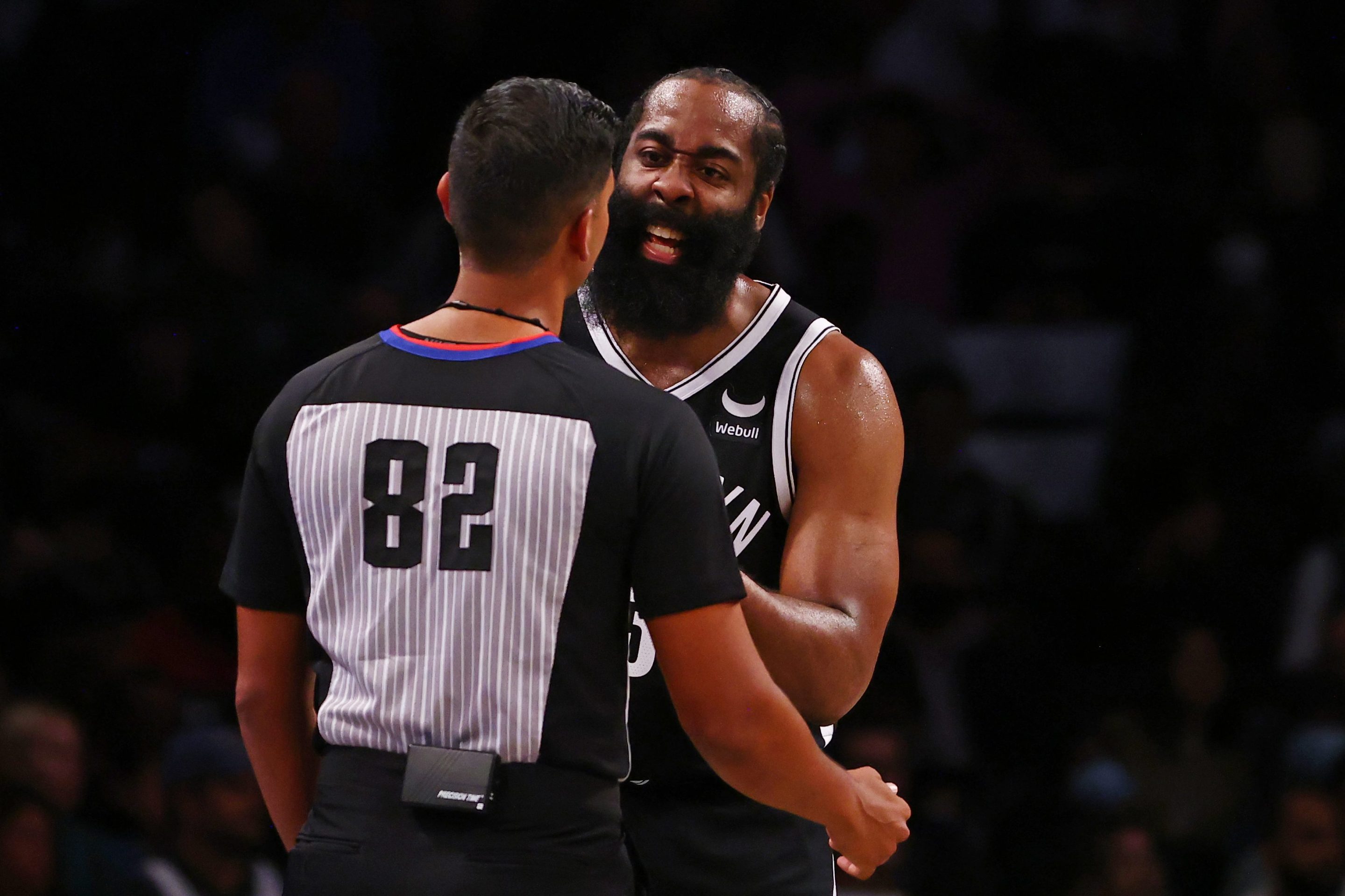 James Harden argues with a referee.