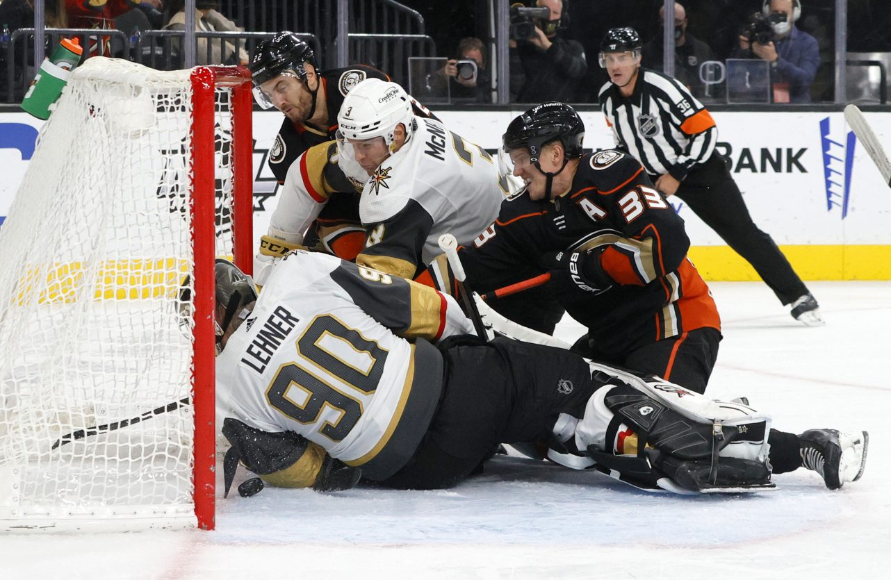 Robin Lehner fights to keep the puck out of the net