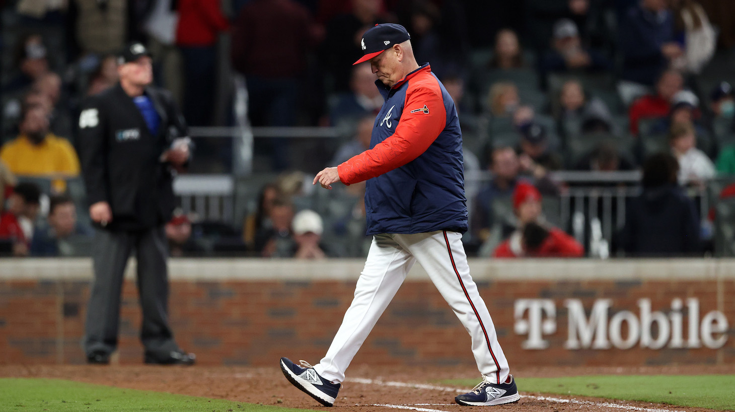 ATLANTA, GEORGIA - OCTOBER 31: Manager Brian Snitker #43 of the Atlanta Braves makes a pitching change during the fourth inning against the Houston Astros in Game Five of the World Series at Truist Park on October 31, 2021 in Atlanta, Georgia. (Photo by Elsa/Getty Images)