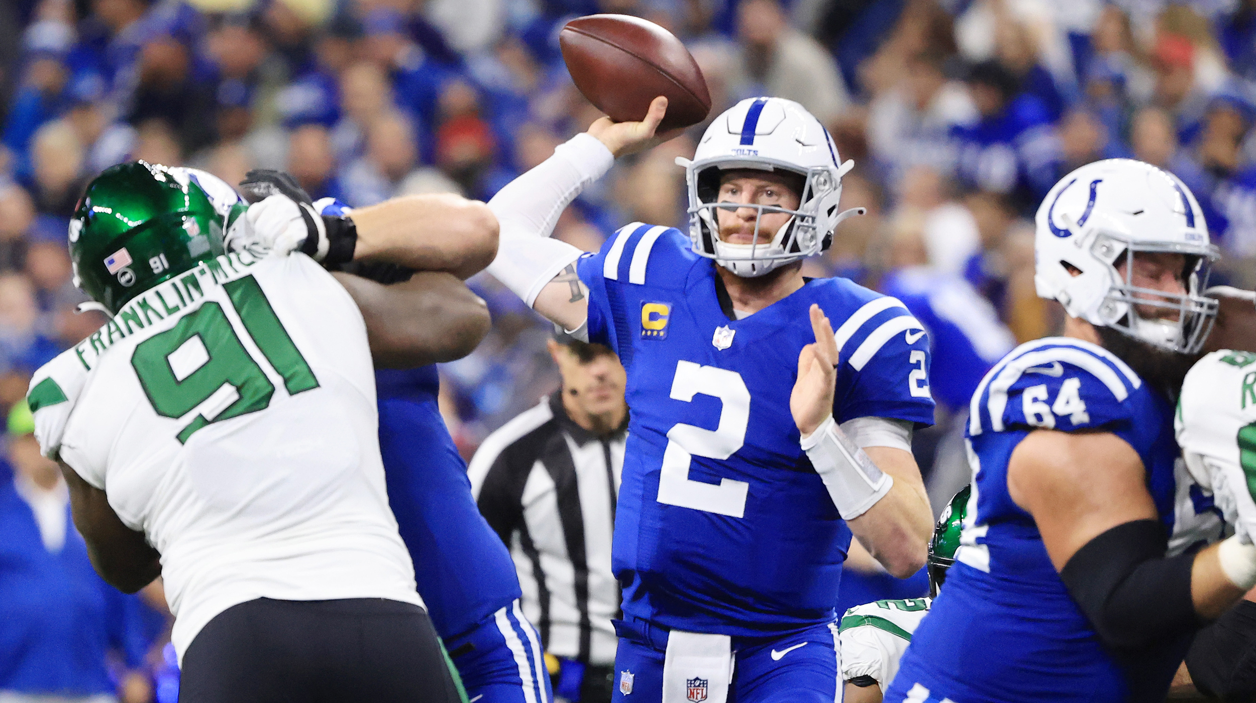 Carson Wentz #2 of the Indianapolis Colts looks to pass during the first half at Lucas Oil Stadium against the New York Jets on November 04, 2021 in Indianapolis, Indiana.