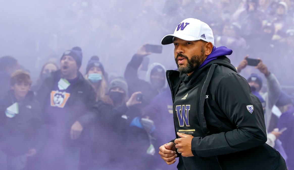 SEATTLE, WASHINGTON - NOVEMBER 06: Head coach Jimmy Lake of the Washington Huskies takes the field before the game against the Oregon Ducks at Husky Stadium on November 06, 2021 in Seattle, Washington. (Photo by Steph Chambers/Getty Images)