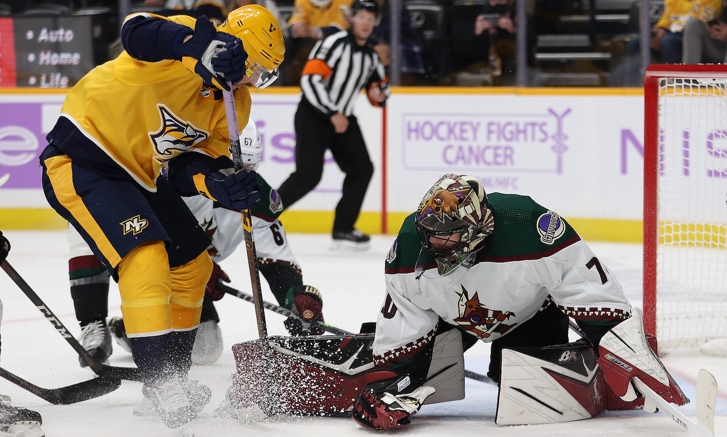 Matt Duchene #95 of the Nashville Predators takes a shot against Karel Vejmelka #70 of the Arizona Coyotes during the third period at Bridgestone Arena on November 13, 2021 in Nashville, Tennessee. The Nashville Predators won 4-1.