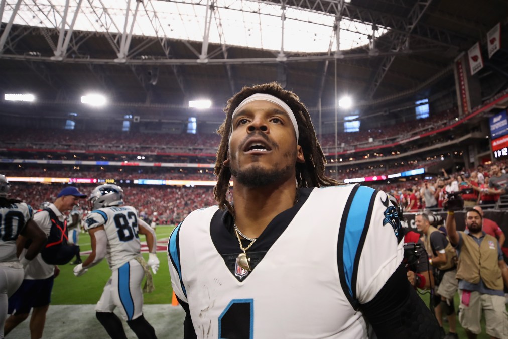Quarterback Cam Newton #1 of the Carolina Panthers reacts after scoring on a 2-yard rushing touchdown against the Arizona Cardinals during the first quarter of the NFL game at State Farm Stadium on November 14, 2021 in Glendale, Arizona. The Panthers defeated the Cardinals 34-10.
