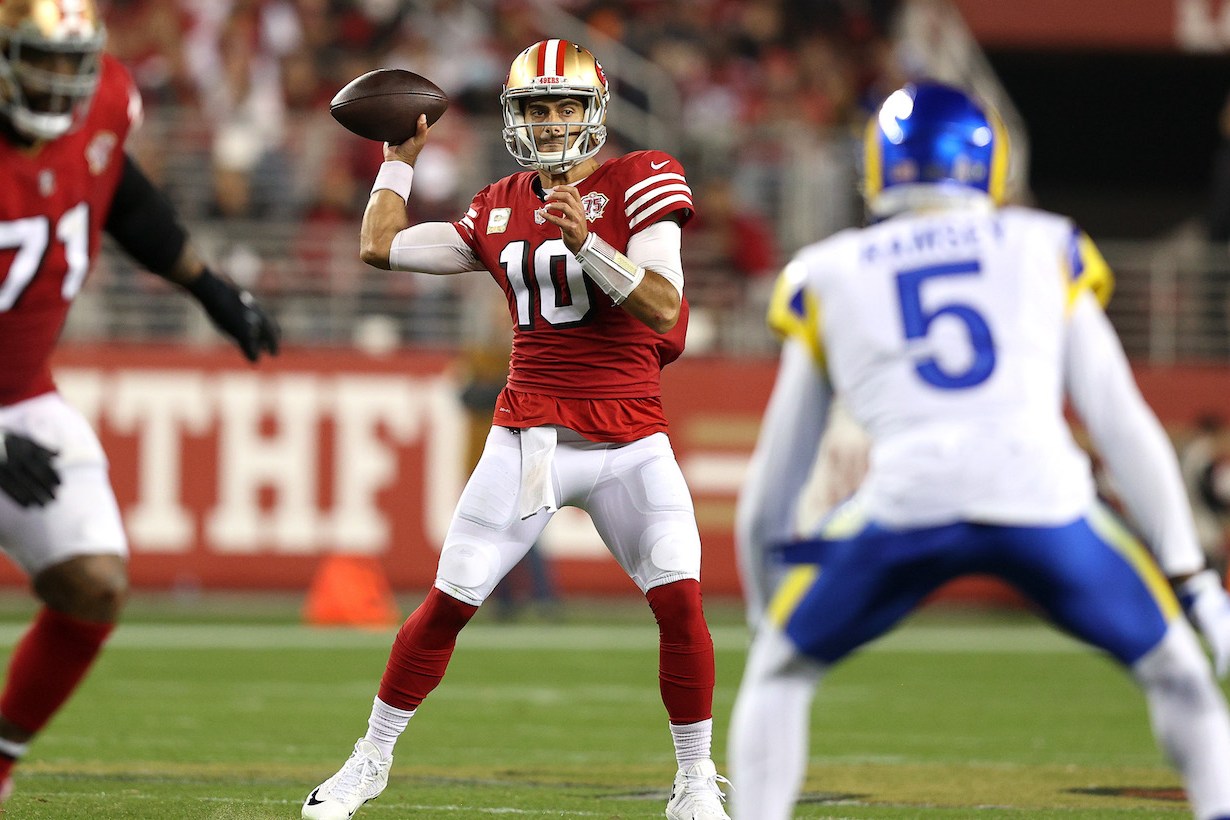 SANTA CLARA, CALIFORNIA - NOVEMBER 15: Jimmy Garoppolo #10 of the San Francisco 49ers looks for an open teammate during the third quarter in the game against the Los Angeles Rams at Levi's Stadium on November 15, 2021 in Santa Clara, California. (Photo by Ezra Shaw/Getty Images)