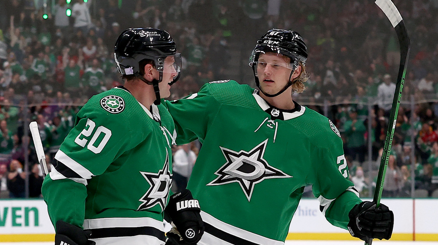 DALLAS, TEXAS - NOVEMBER 16: Ryan Suter #20 of the Dallas Stars celebrates with Riley Tufte #27 of the Dallas Stars after scoring a goal against the Detroit Red Wings in the first period at American Airlines Center on November 16, 2021 in Dallas, Texas. (Photo by Tom Pennington/Getty Images)