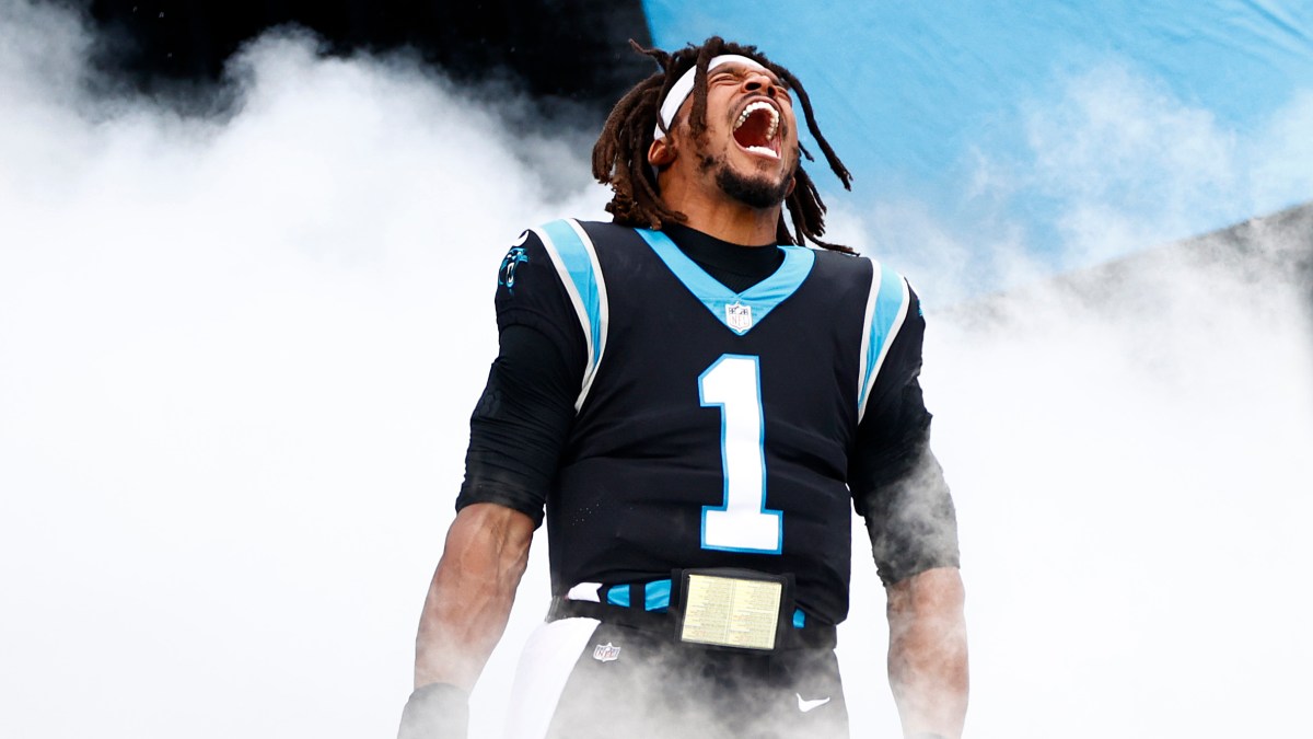 Cam Newton roaring amid smoke machine effects while being introduced before the Panthers' Week 11 game.