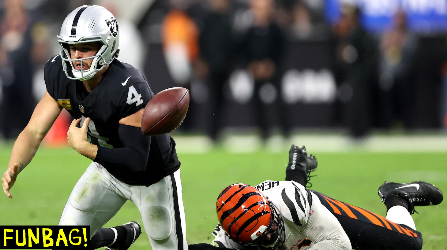 LAS VEGAS, NEVADA - NOVEMBER 21: Derek Carr #4 of the Las Vegas Raiders fumbles the ball during the fourth quarter in the game against the Cincinnati Bengals at Allegiant Stadium on November 21, 2021 in Las Vegas, Nevada. (Photo by Matthew Stockman/Getty Images)